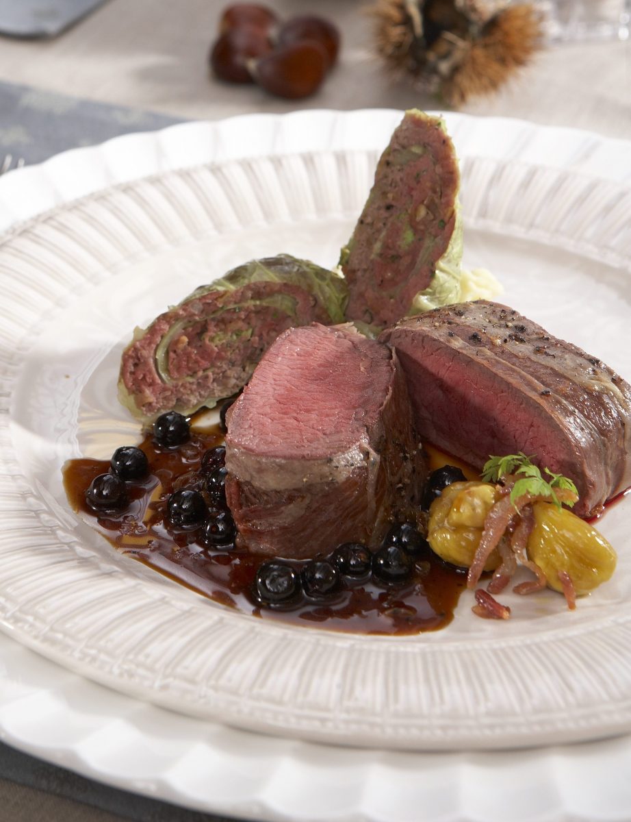 Cervena loin in black forest ham with chestnut and cabbage